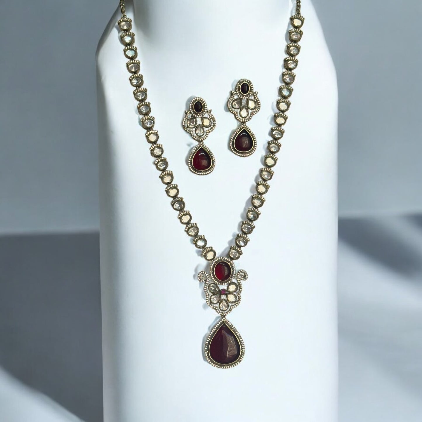 Premium Moissanite Red Kundan Necklace and Earrings set featuring intricate detailing and rich red tones for a luxurious statement.