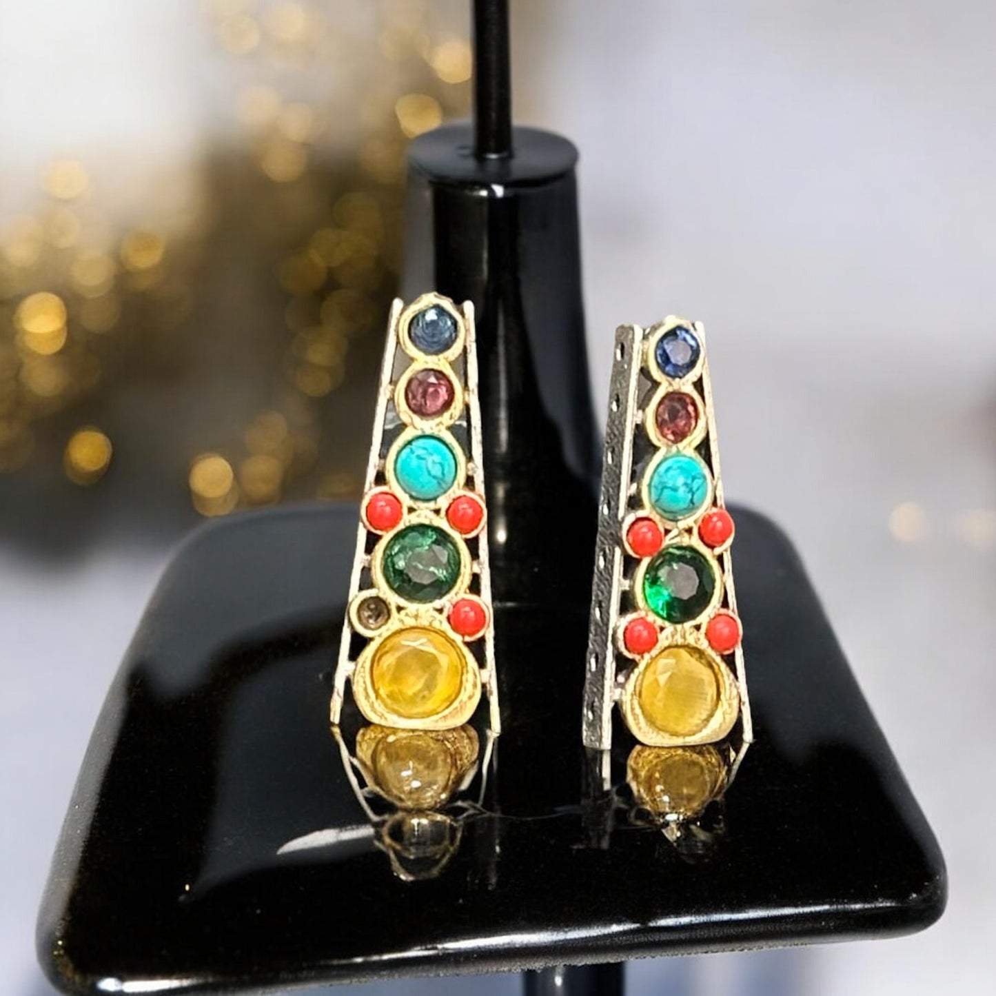Matching Studs of a Royal Pearl Necklace Set, featuring colorful gemstones in red, green, and yellow, displayed on a black jewellery display stand with a neutral background.