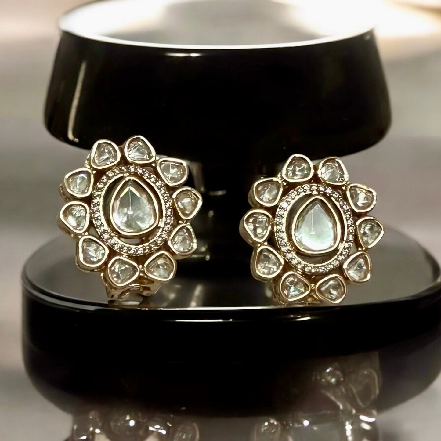 Tyani Kundan pearl necklace set's large matching studs displayed on a black coloured jewellery display stand β Bella & Diva