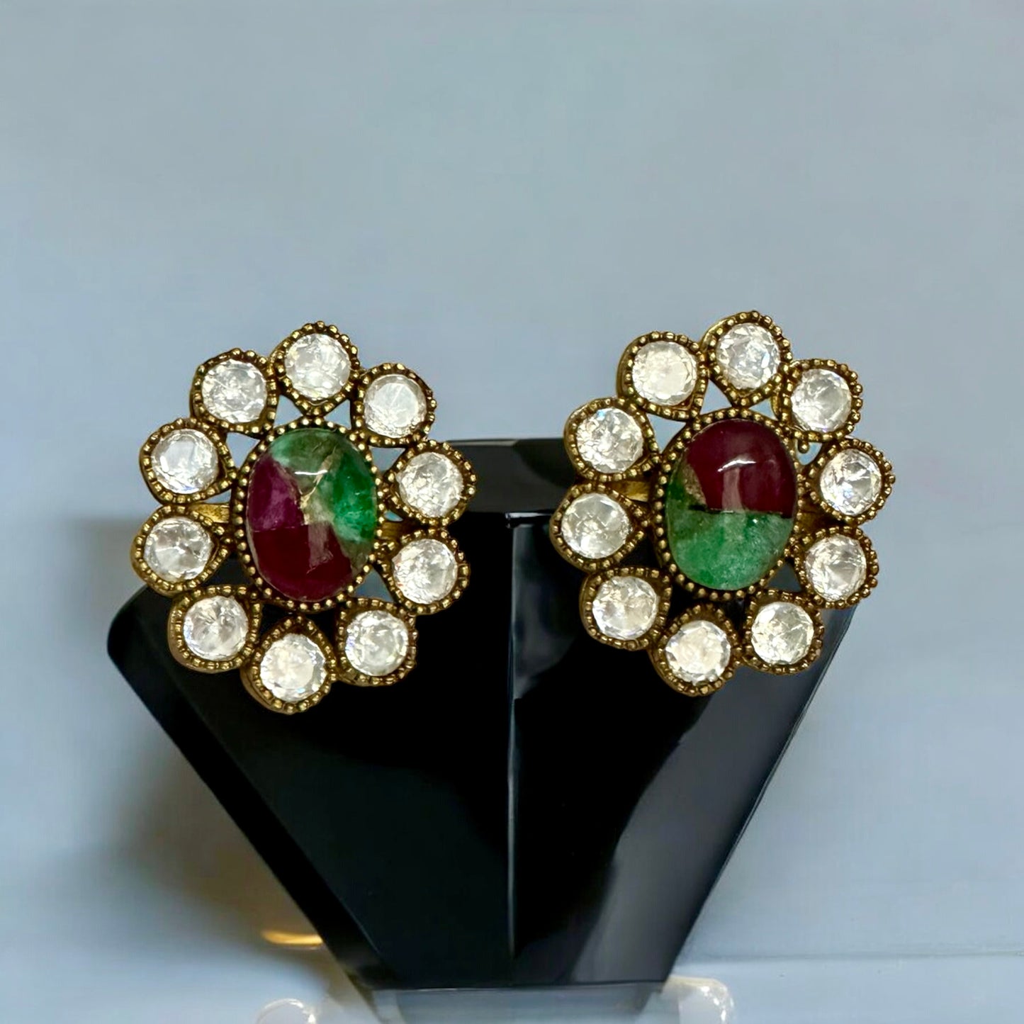 Premium Indian moissanite necklace set's double marble stone multicolor studs on black jewellery display stand β Bella & Diva