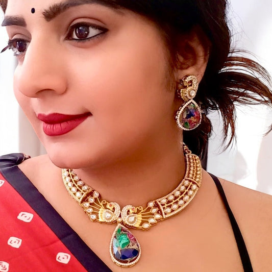 A Model Displaying Premium doublet multicolor stone necklace featuring intricate moissanite kundan work in a peacock-inspired design, paired with matching earrings.