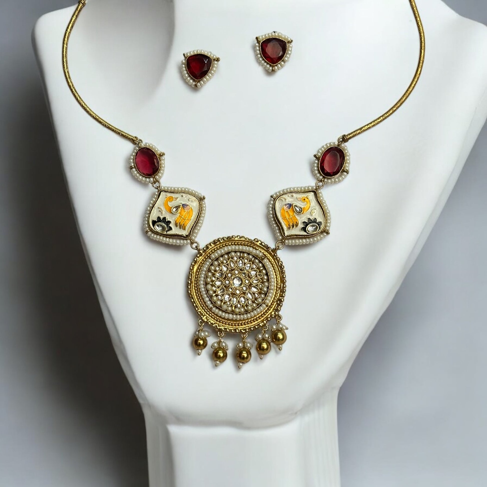 Amrapali Designer Hand-Painted Red Necklace with Studs – a traditional masterpiece with pearl detailing, Kundan stones, and intricate hand-painted motifs.