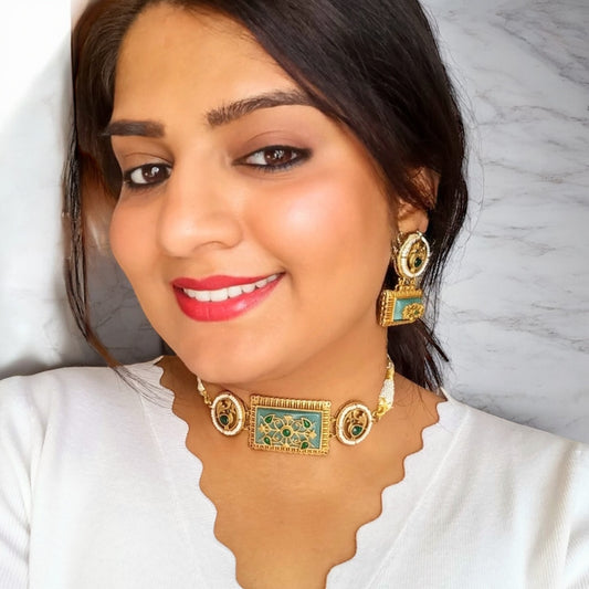A model displaying an Amrapali Minimal Choker Set in Mint Green Monalisa Stone Work with matching earrings and gold-tone accents, for sale online in UK on bella and Diva.