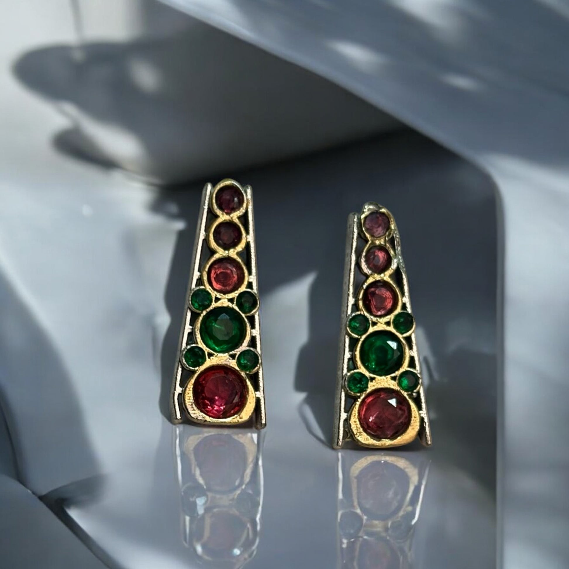 Elegant earrings with red and green stone accents, perfect for festive and traditional occasions.