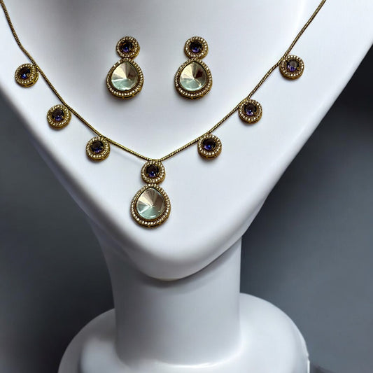 Beautiful Polki Kundan Chain Necklace in Purple Colour with Matching Earrings – elegant gold-tone chain necklace adorned with purple stones and polki kundan detailing. A perfect set for weddings, festive wear, and special occasions.