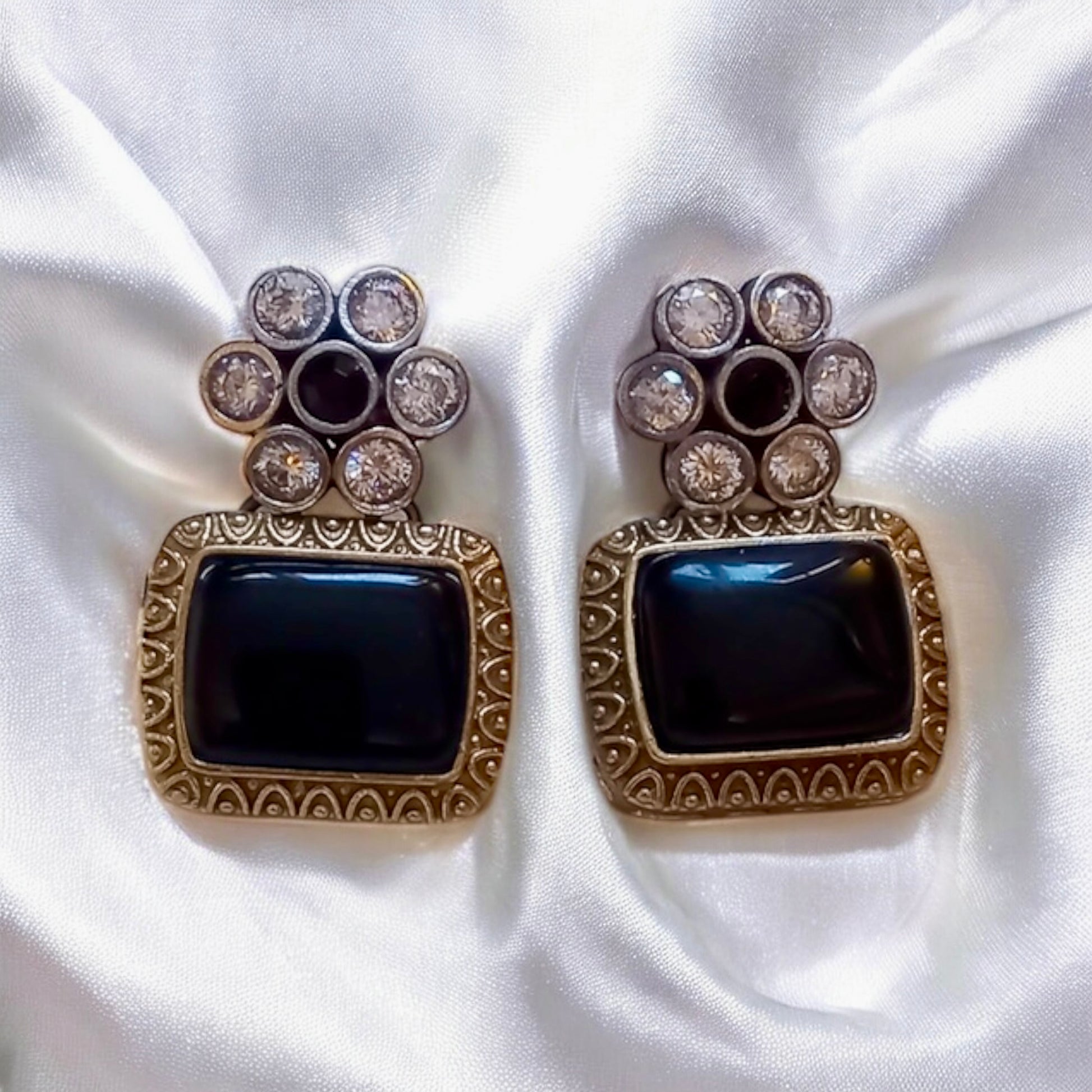 German silver hasli Earrings of necklace set with black Monalisa stones square black shape on cream satin background