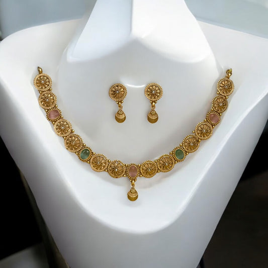 Gold-plated Rajwadi necklace set with intricate circular motifs and pastel green and pink accents, paired with matching gold-plated earrings, displayed on a white mannequin with a clean backdrop.