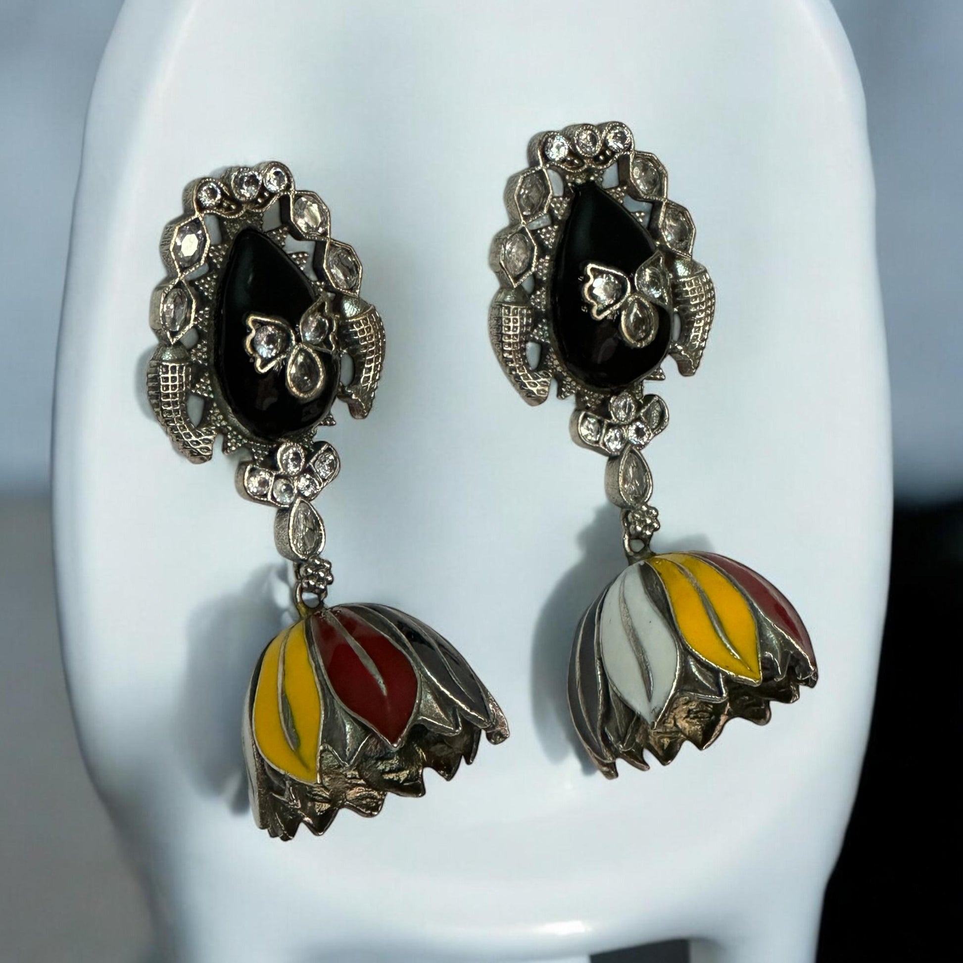 Multi-colour handprint silver replica jhumki earrings featuring black, red, yellow and white enamel – Indian traditional designer jewellery by Bella & Diva.