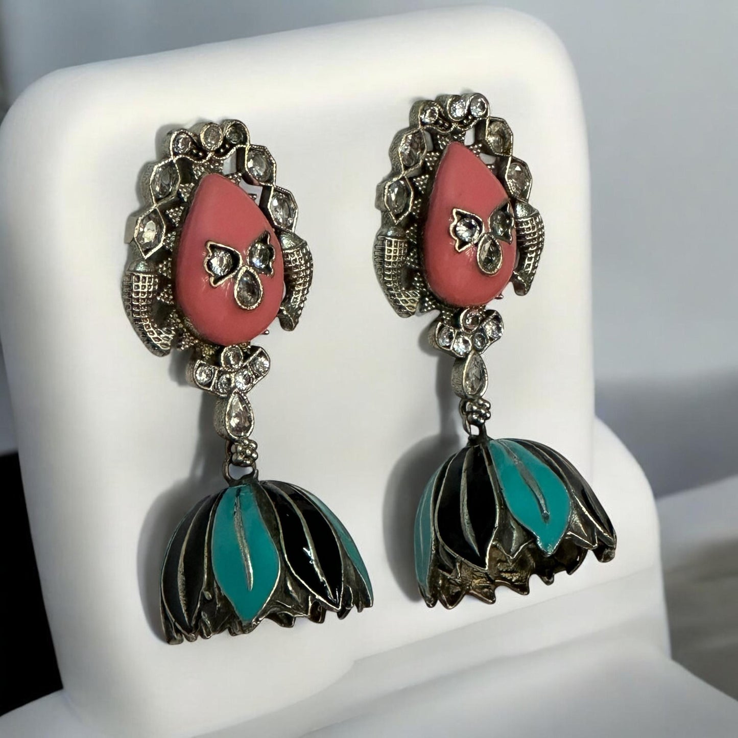 side view of Handprint peach and sky blue silver replica jhumka earrings with teardrop studs and crystal accents – Bella & Diva imitation jewellery.