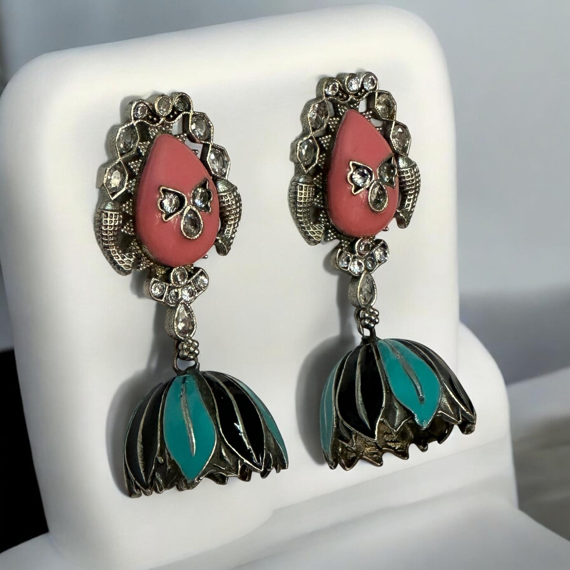side view of Handprint peach and sky blue silver replica jhumka earrings with teardrop studs and crystal accents – Bella & Diva imitation jewellery.