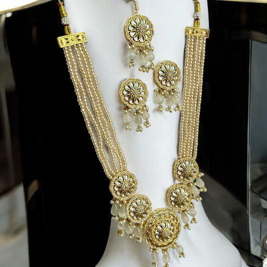 Kundan Pearl Golden Necklace Set with Earrings and Tikka - Traditional Indian Gold Plated Jewelry, Featuring Golden Beads and Pearl Drops - Displayed on White Jewelry Stand for Elegant Presentation
