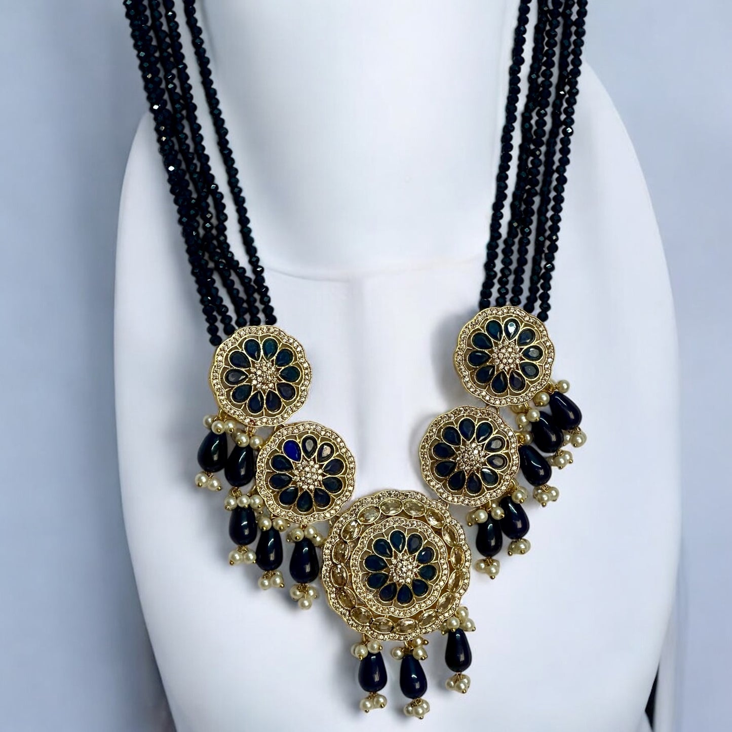 Kundan Pearl Navy Blue Necklace - Traditional Indian Gold Plated Jewelry, Navy Blue Beads and Pearl Drops - Displayed on White Jewelry Stand for Elegant Presentation