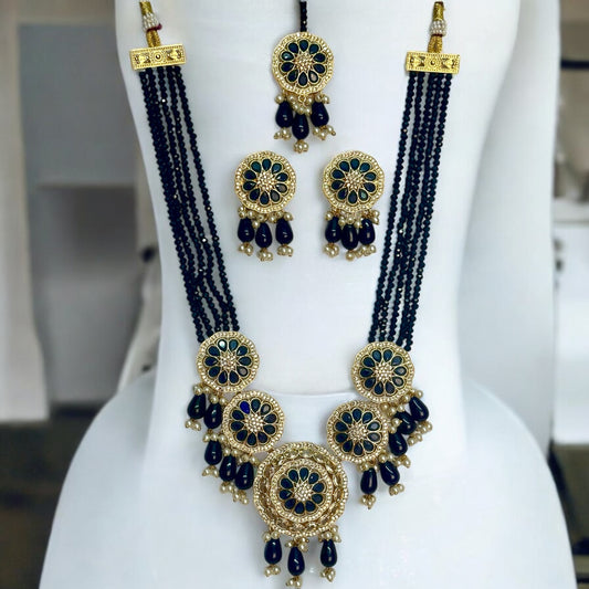 Kundan Pearl Navy Blue Necklace Set with Earrings and Tikka - Traditional Indian Gold Plated Jewelry, Featuring Navy Blue Beads and Pearl Drops - Displayed on White Jewelry Stand for Elegant Presentation