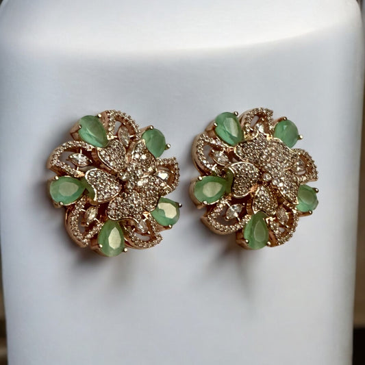 Mint green floral American diamond earrings with rose gold polish, perfect for formal and festive occasions.