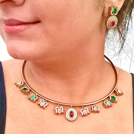 A model wearing a Moissanite Premium Hasli in Multi-Colour Necklace Set with Matching Earringss – a modern gold-tone necklace with sparkling moissanite stones and vibrant multi-colour accents. Ideal for festive and traditional occasions.