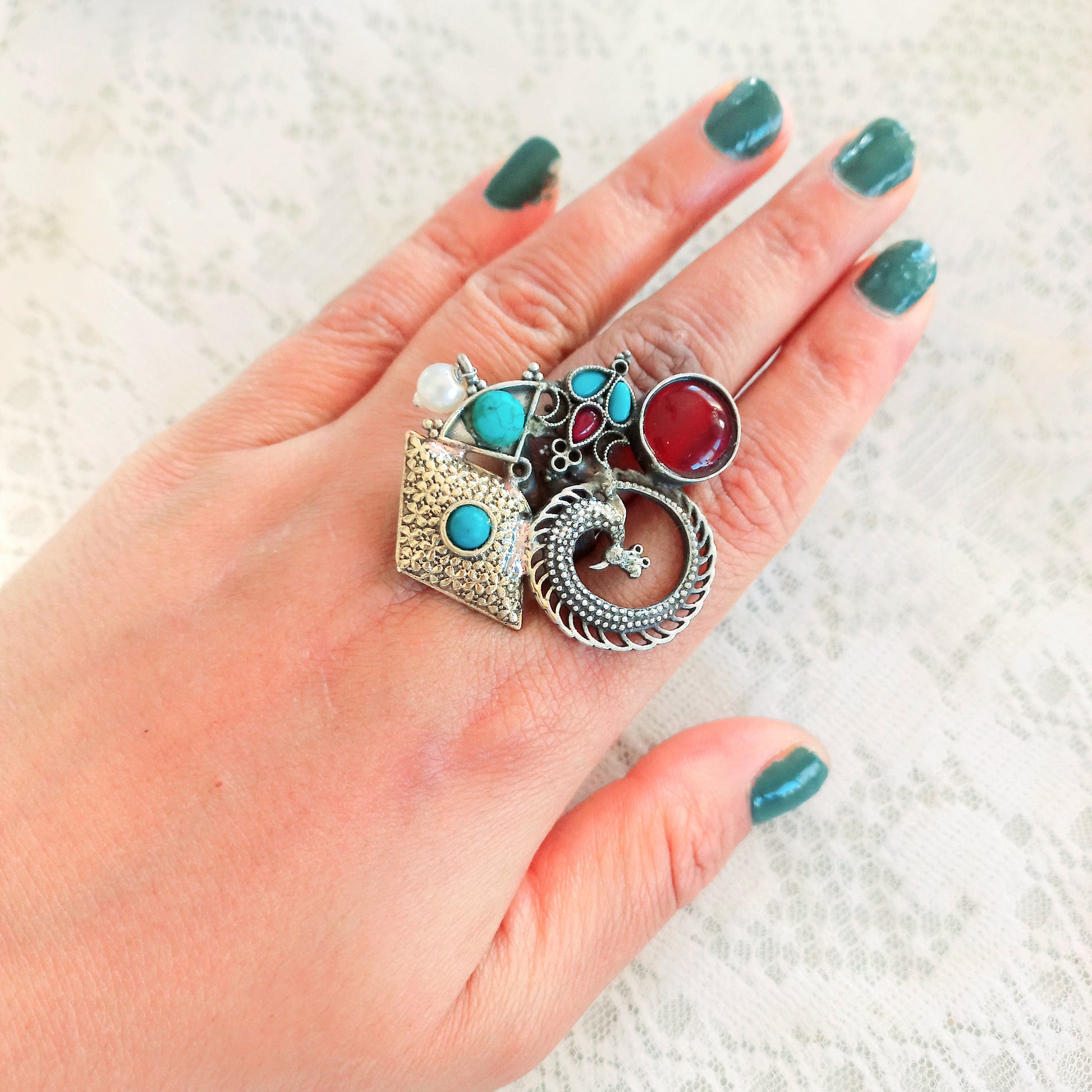 Multicolor Fusion Oxidised Ring - A vibrant, handcrafted ring featuring a blend of colorful gemstones set in an oxidised silver band, perfect for adding a bold statement to any outfit. Displayed on a models hand with green nail polish