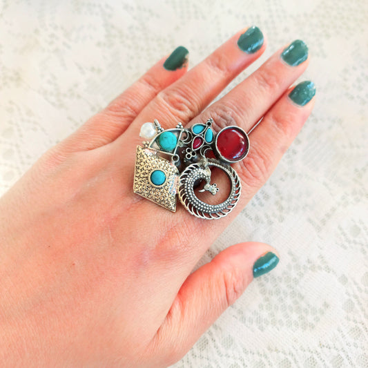 Multicolor Fusion Oxidised Ring - A vibrant, handcrafted ring featuring a blend of colorful gemstones set in an oxidised silver band, perfect for adding a bold statement to any outfit. Displayed on a models hand with green nail polish