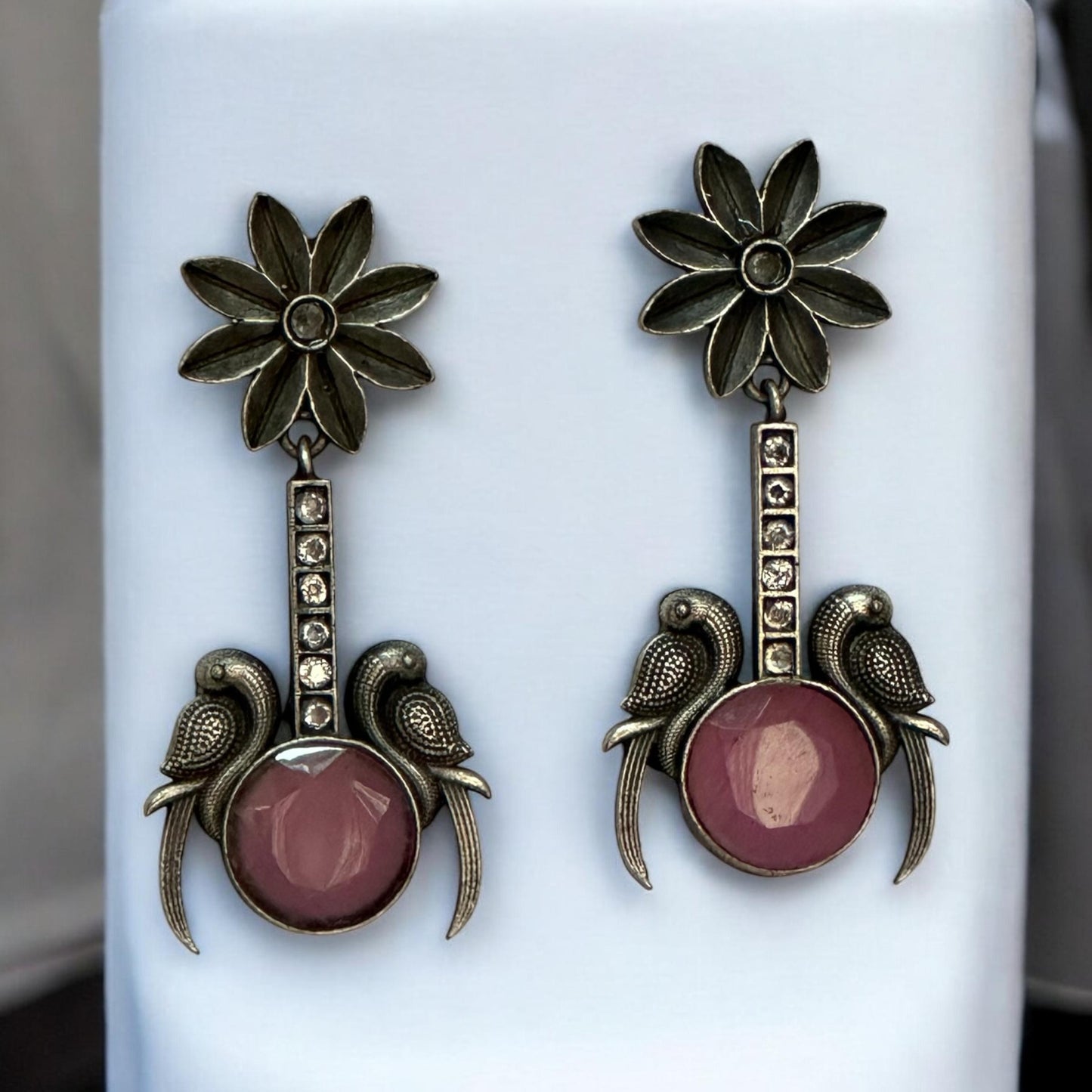 Close-up of Pink Stone Silver Replica Earrings featuring dual bird design and antique floral motif – ethnic jewellery for women in London UK