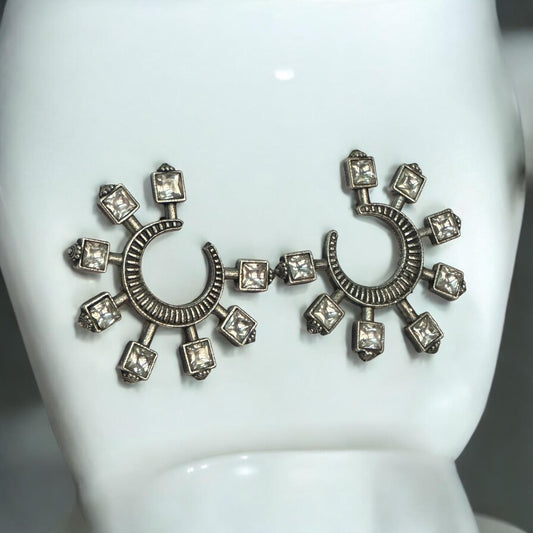 Polki silver look-alike crescent and square-cut stone earrings displayed on a white stand – Bella & Diva