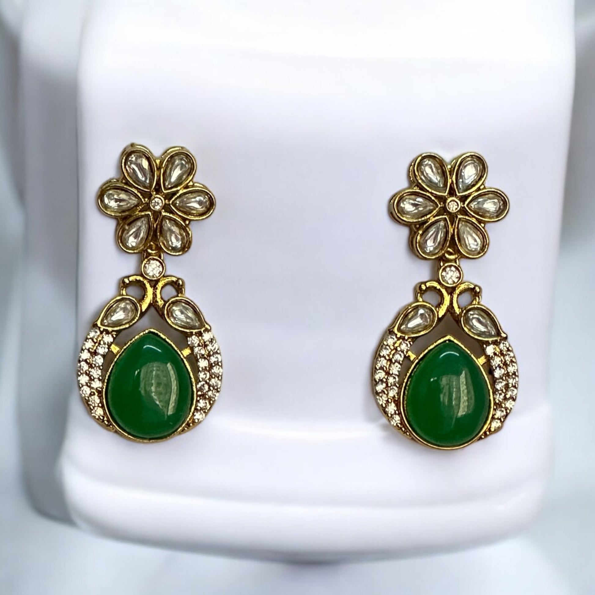 Polki Kundan Premium Necklaces' Matching Earrings – featuring floral motifs, green teardrop stones, and intricate polki and kundan detailing. Perfect for festive and cultural occasions.