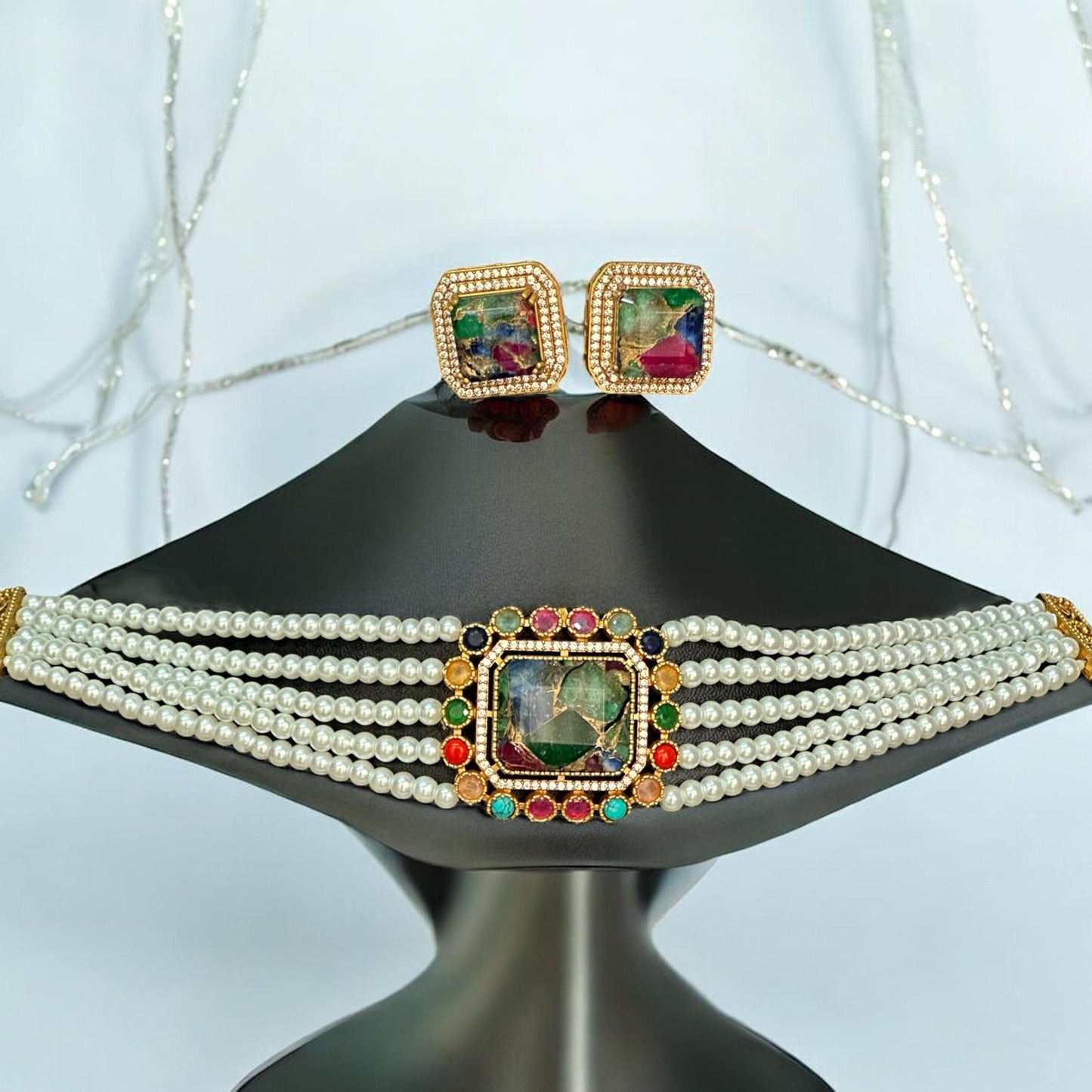 Premium Doublet Multi Colour Stone Choker Necklace Set with White Pearl Beads and matching earrings – elegant Indian designer jewellery for women in UK on a white background on a black jewellery display stand.