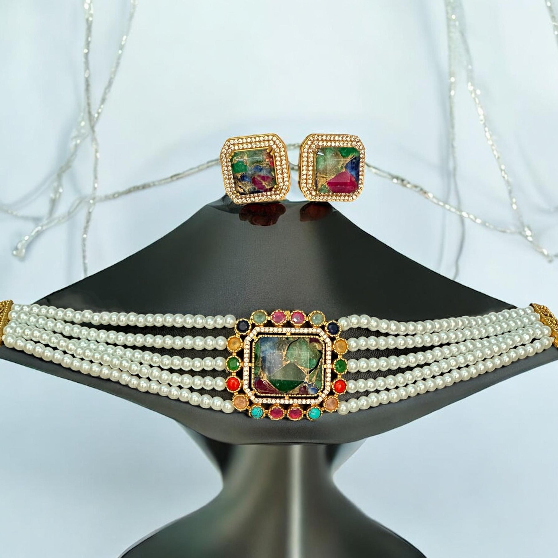 Premium Doublet Multi Colour Stone Choker Necklace Set with White Pearl Beads and matching earrings – elegant Indian designer jewellery for women in UK on a white background on a black jewellery display stand.
