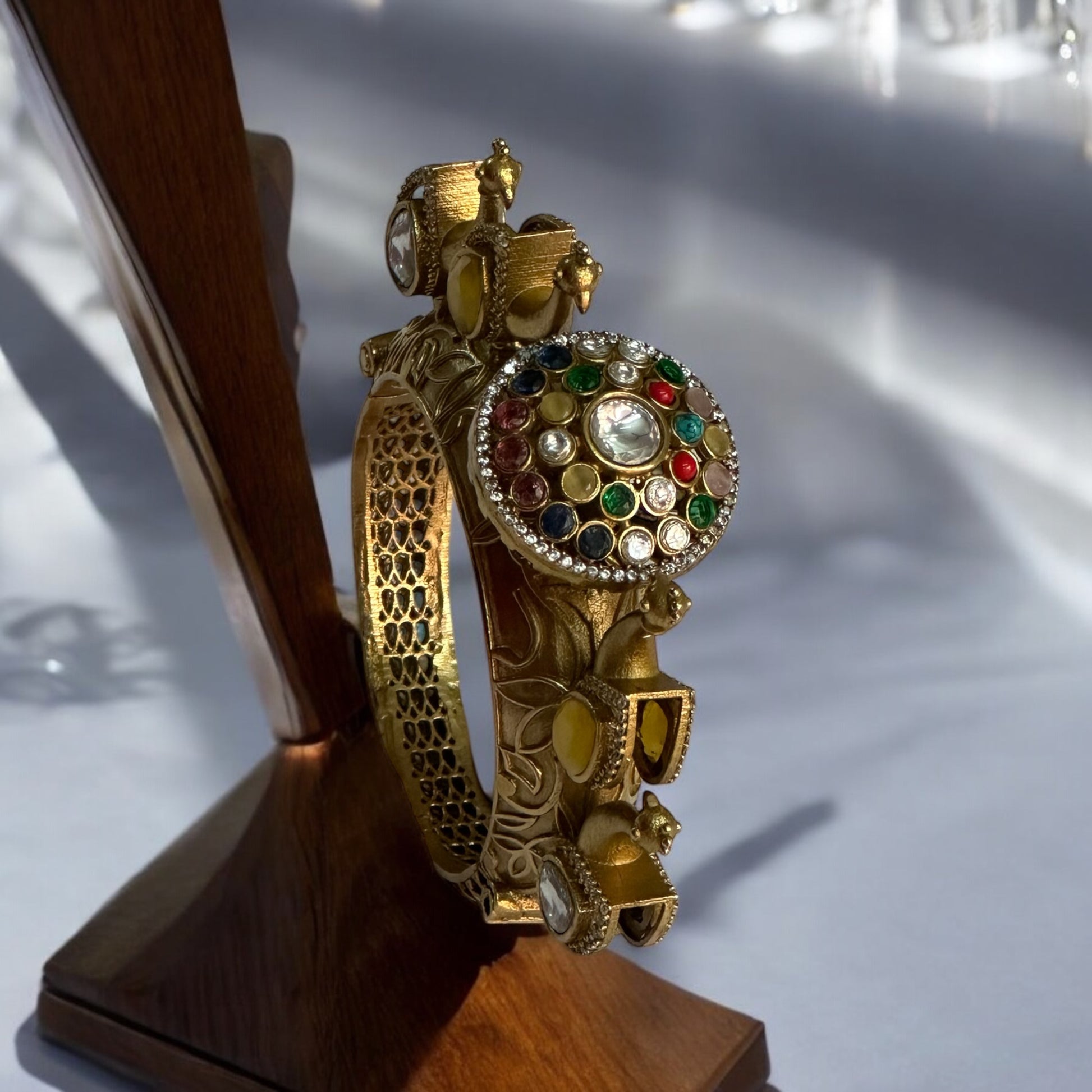 Exquisite Premium Moissanite Peacock Design Kada with intricate gold detailing and vibrant multicolored gemstones.