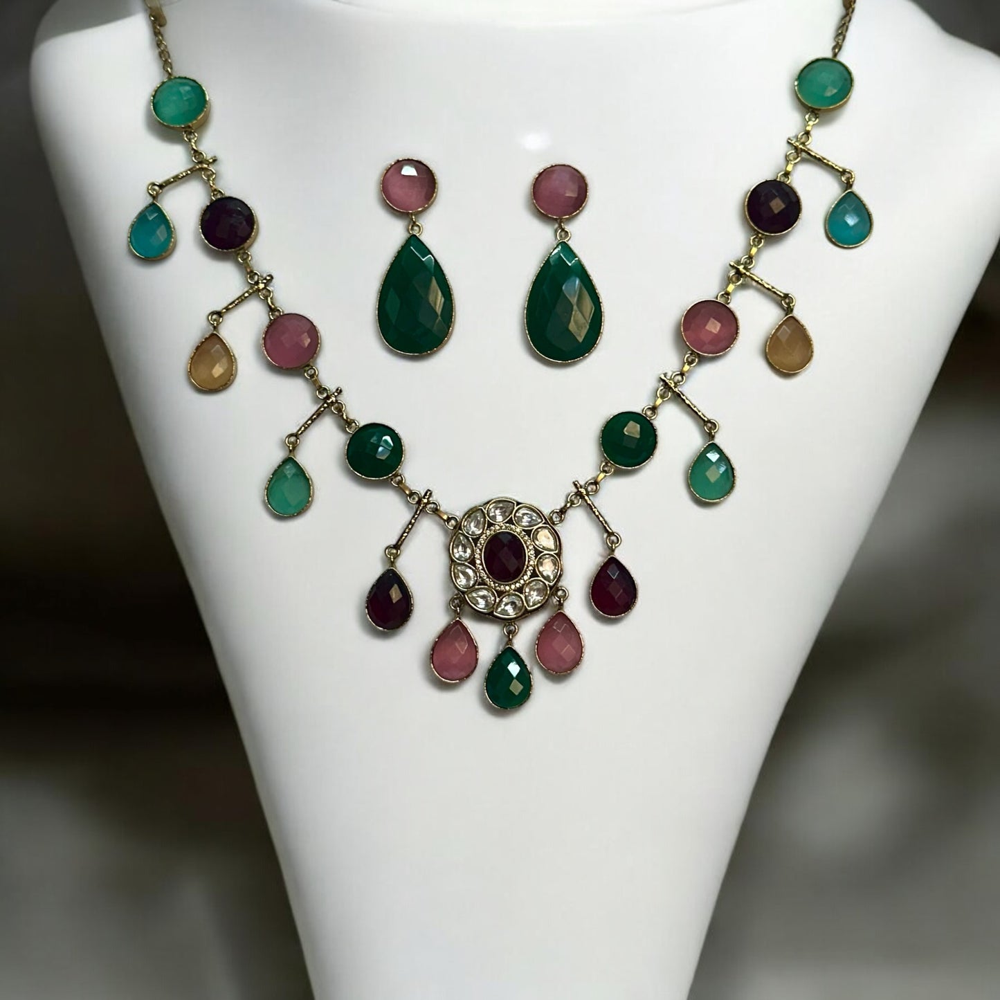 Premium Polki Kundan With Semi-Precious Stone Multi Colour Necklace Set With Earrings on a white coloured Jewellery Display Stand.