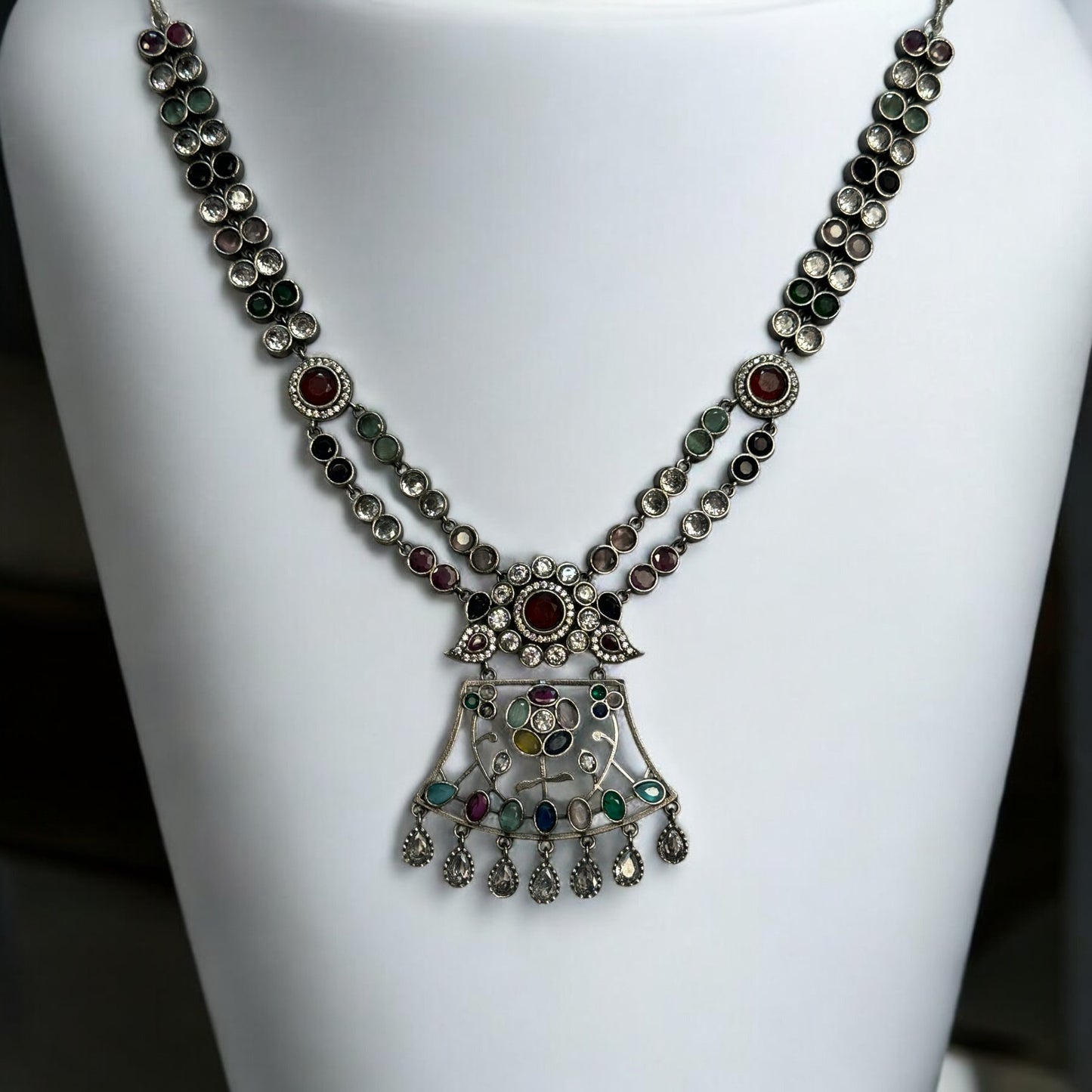 Premium Silver Look-Alike Multicolor Statement Necklace – intricately designed silver-tone necklace with vibrant multicolor stones. Perfect for festive and cultural occasions.