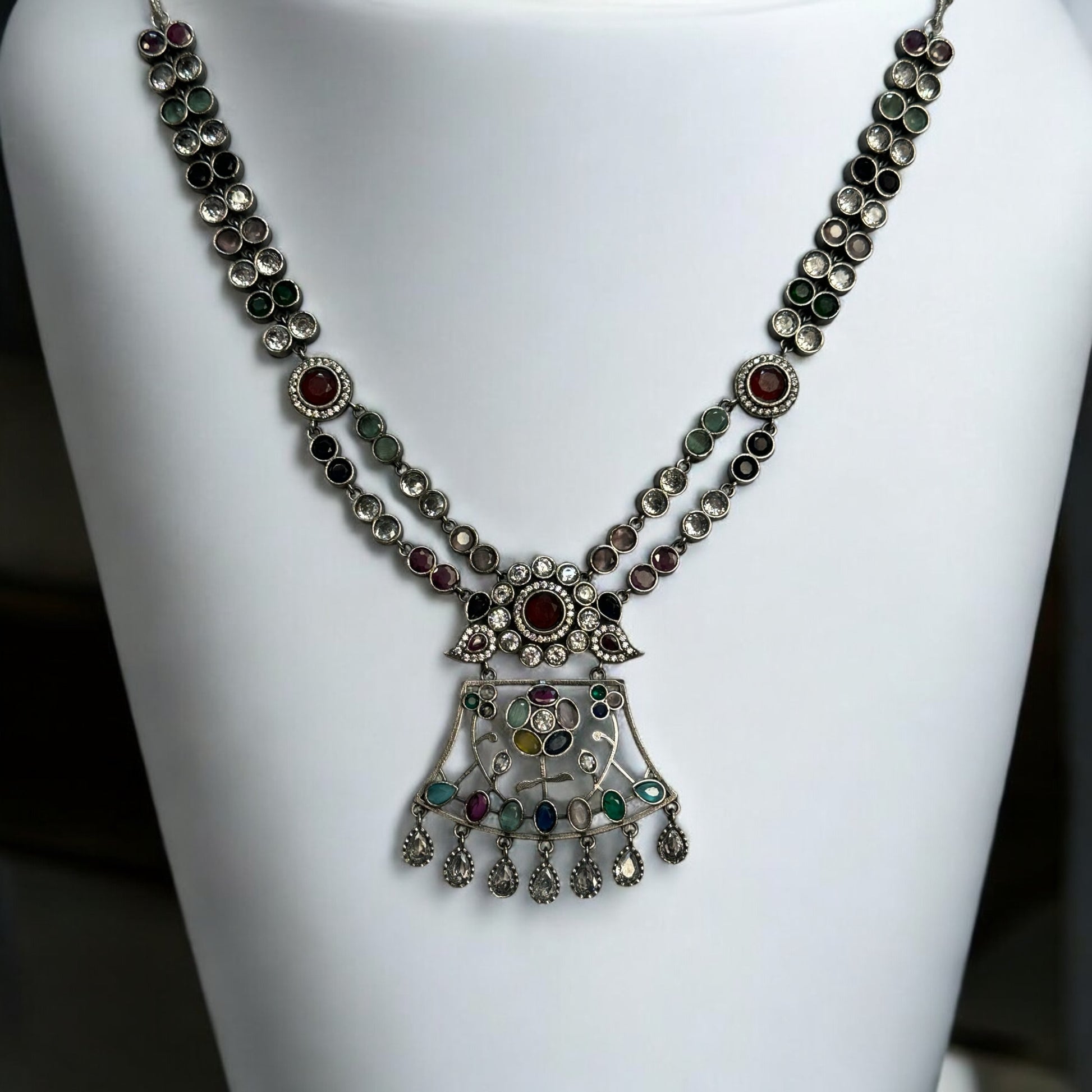 Premium Silver Look-Alike Multicolor Statement Necklace – intricately designed silver-tone necklace with vibrant multicolor stones. Perfect for festive and cultural occasions.