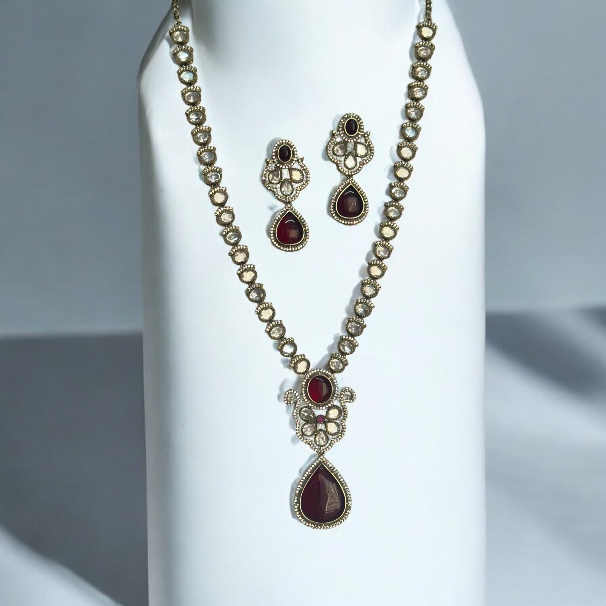 Premium Moissanite Red Kundan Necklace and Earrings set featuring intricate detailing and rich red tones for a luxurious statement.