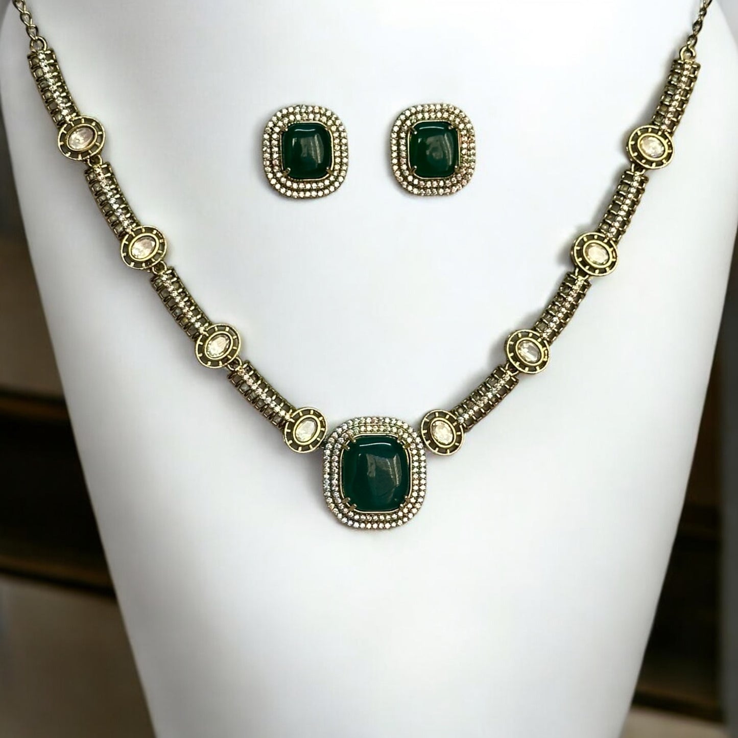 Premium Polki Kundan Necklace Set with Earrings in Green Color – elegant gold-tone necklace with vibrant green stones, polki kundan work, and matching stud earrings. Perfect for weddings and festive occasions.