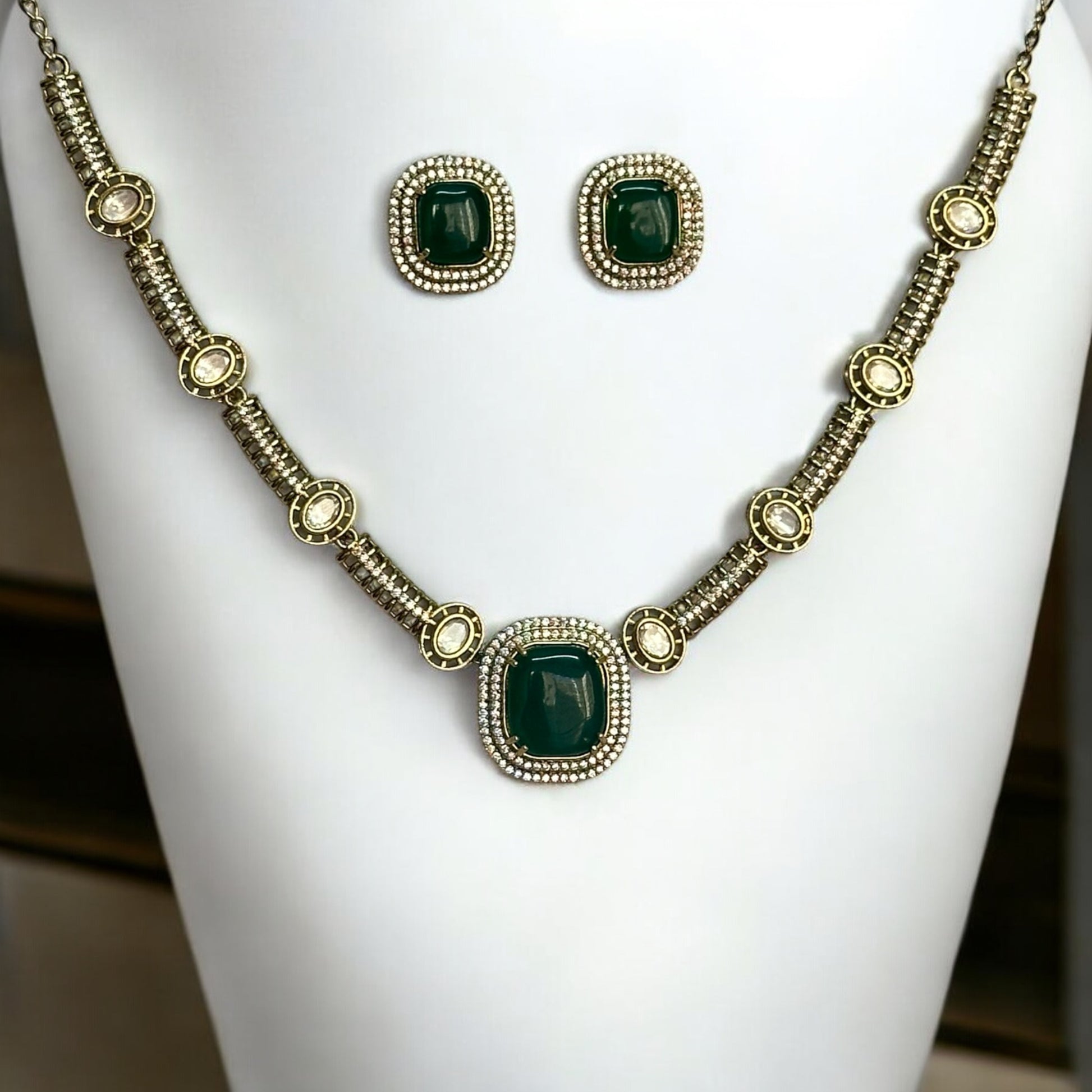 Premium Polki Kundan Necklace Set with Earrings in Green Color – elegant gold-tone necklace with vibrant green stones, polki kundan work, and matching stud earrings. Perfect for weddings and festive occasions.