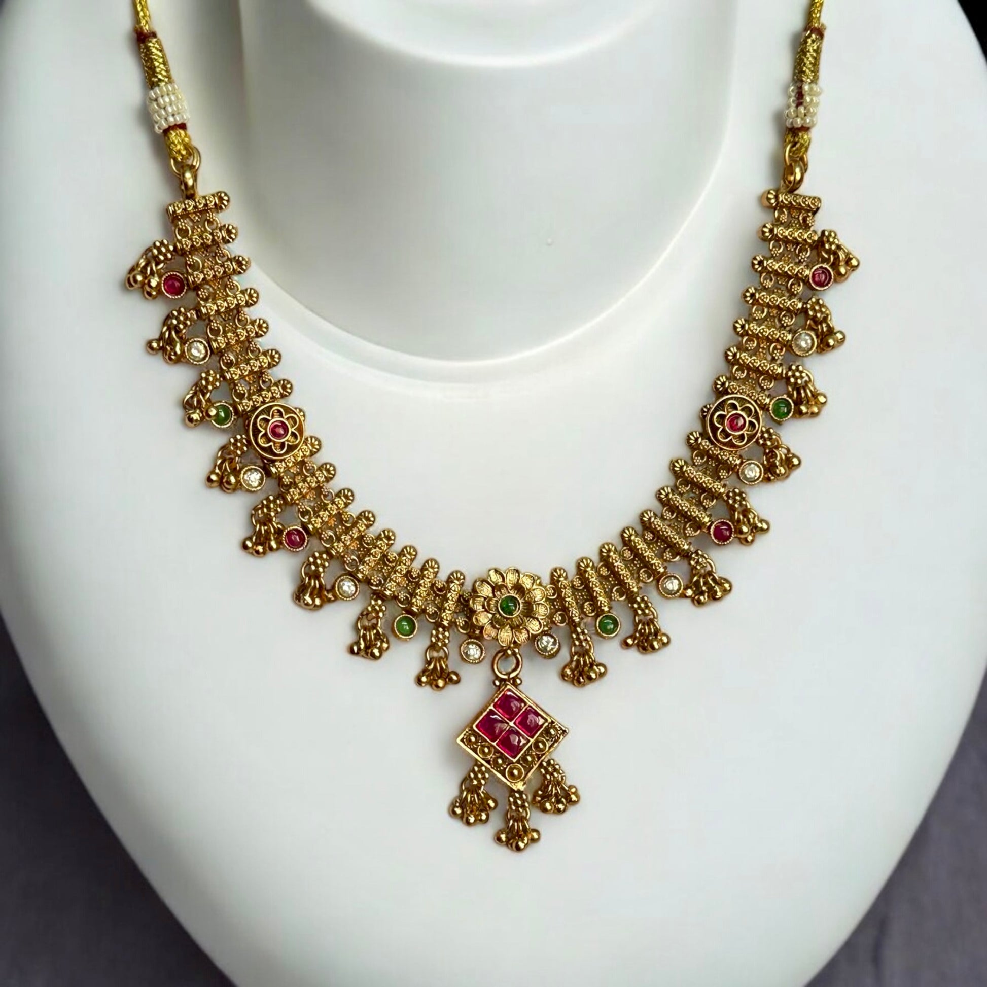 Premium Rajwadi Kundan Necklace – Traditional Indian Jewelry featuring intricate gold-tone detailing, colorful kundan stones, and an elegant pendant design. Perfect for weddings, festive occasions, and ethnic wear styling. 