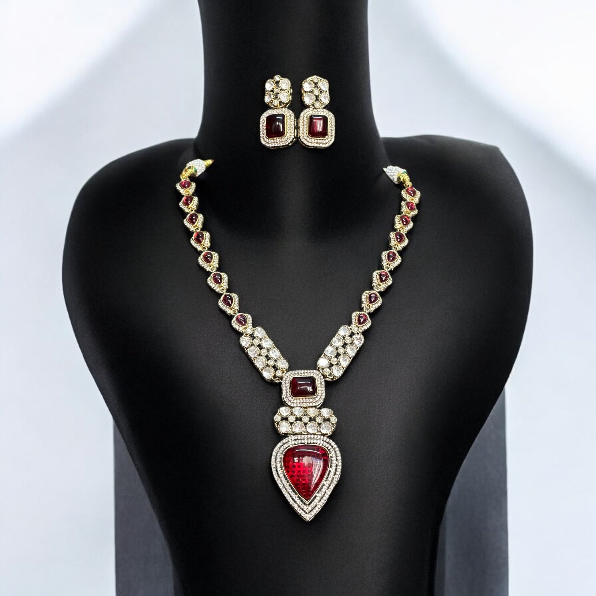 Real Moissanite Kundan Long Necklace with red gemstones and matching earrings, featuring a pear-shaped pendant and intricate detailing.