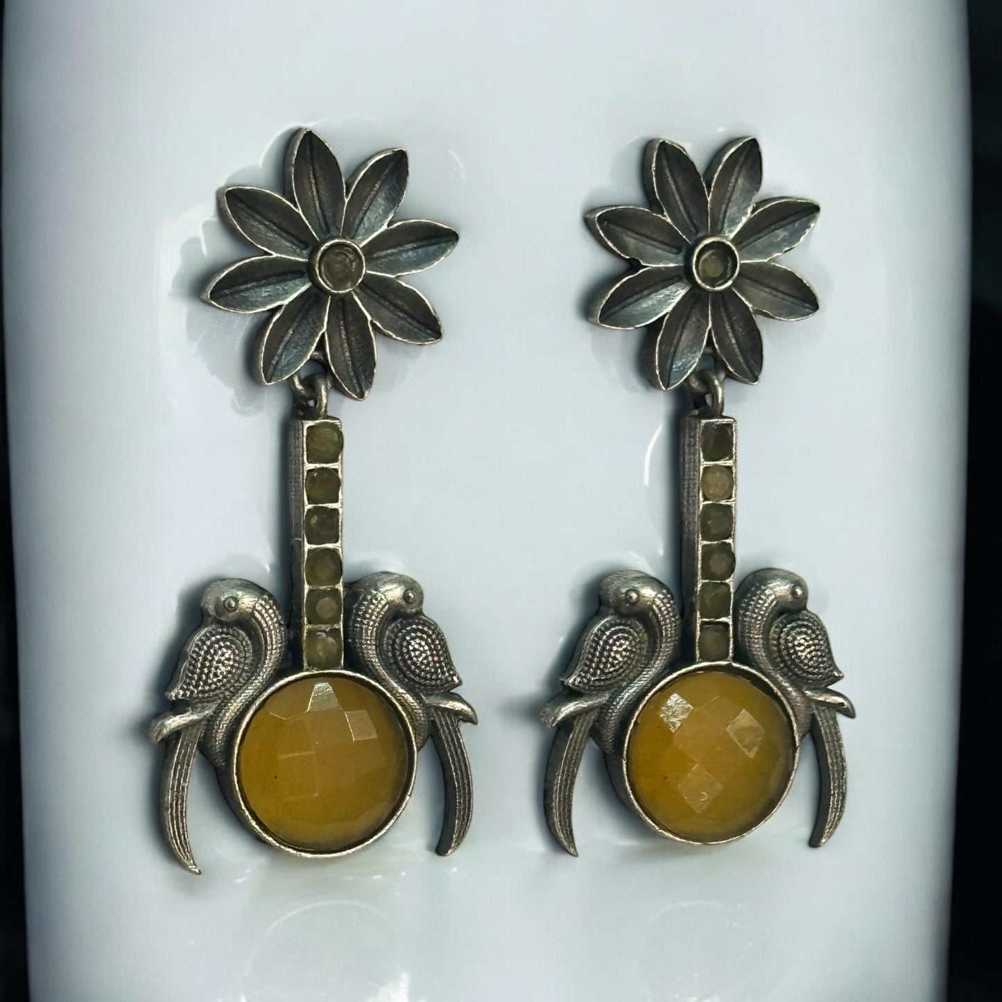 Close-up of Yellow Stone Silver Replica Earrings featuring dual bird design and antique floral motif – ethnic jewellery for women in London UK