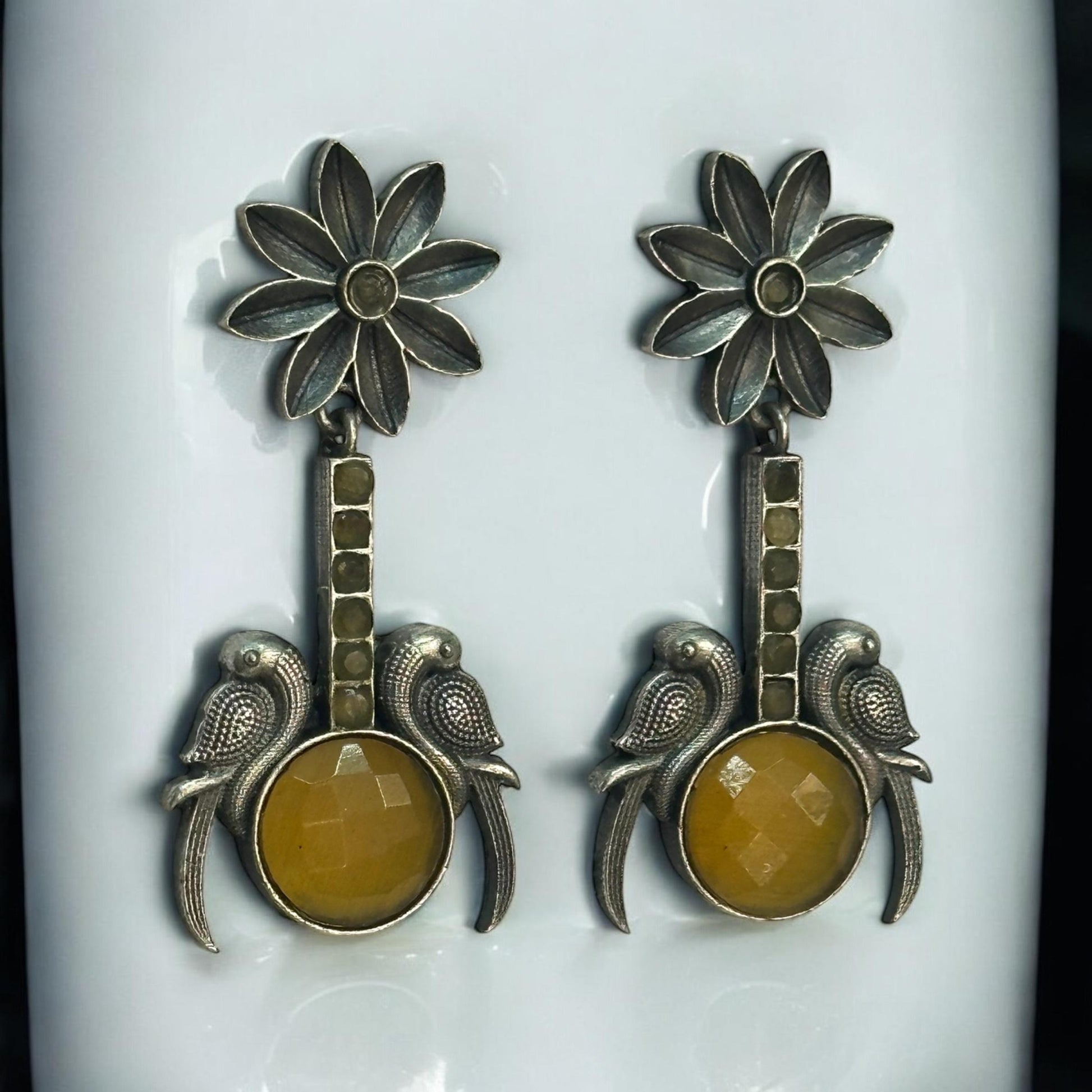 Close-up of Yellow Stone Silver Replica Earrings featuring dual bird design and antique floral motif – ethnic jewellery for women in London UK