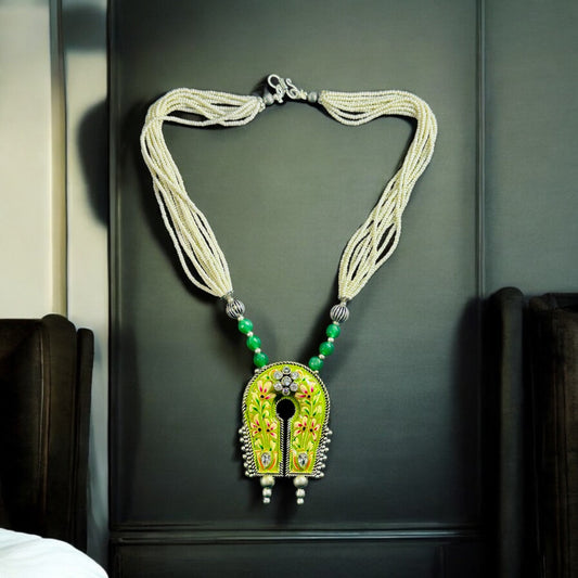 Statement Piece Hand Painted Pendant Silver Look Alike Necklace placed on a black background.