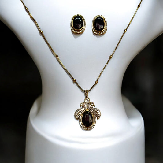 Wine Red Monalisa Stoned Chained Pendant Set – gold-tone chain pendant with a rich wine-red Monalisa stone and American diamond detailing, paired with matching earrings. Perfect for formal and festive occasions.