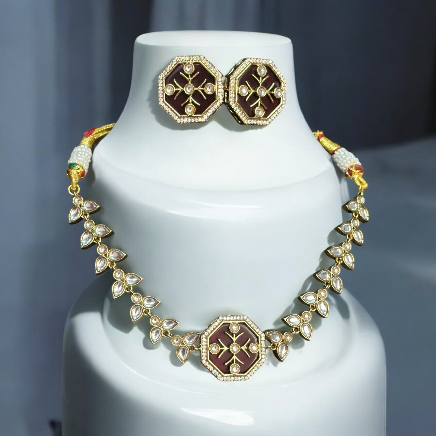 Polki Kundan Necklace with Earrings – intricate design featuring carved red Monalisa stones, polki, and kundan detailing with a gold-tone finish. Ideal for weddings and festive occasions.