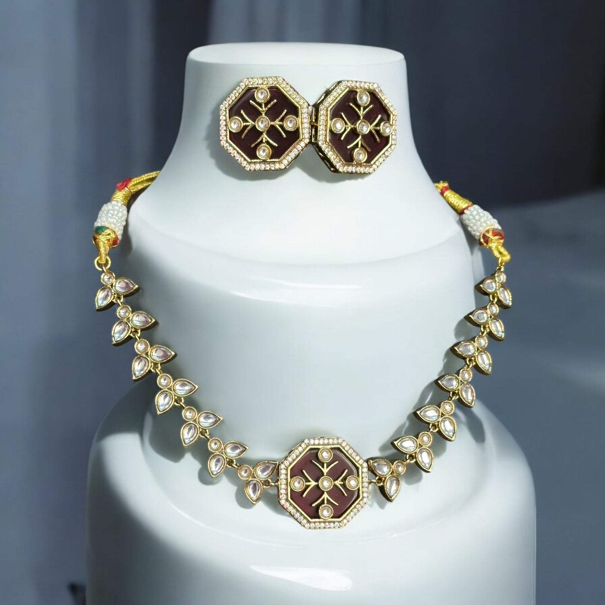 Polki Kundan Necklace with Earrings – intricate design featuring carved red Monalisa stones, polki, and kundan detailing with a gold-tone finish. Ideal for weddings and festive occasions.