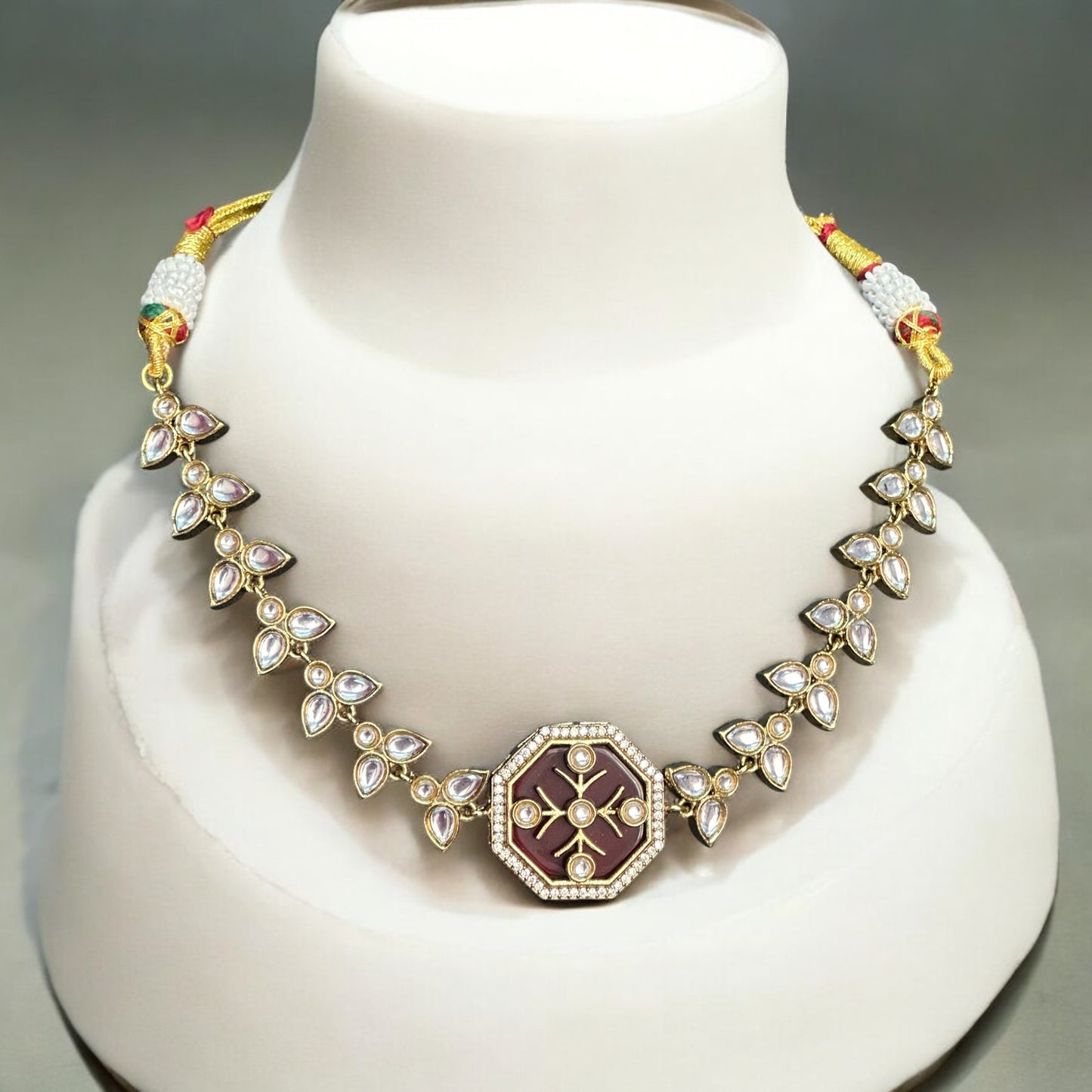 Polki Kundan Necklace – intricate design featuring carved red Monalisa stones, polki, and kundan detailing with a gold-tone finish. Ideal for weddings and festive occasions.