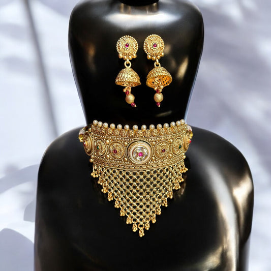 Rajawadi Kundan Choker Necklace with Jhumki Earrings – gold-tone choker with intricate kundan work, pearls, cascading mesh detailing, and matching jhumki earrings. Ideal for weddings and festive occasions.