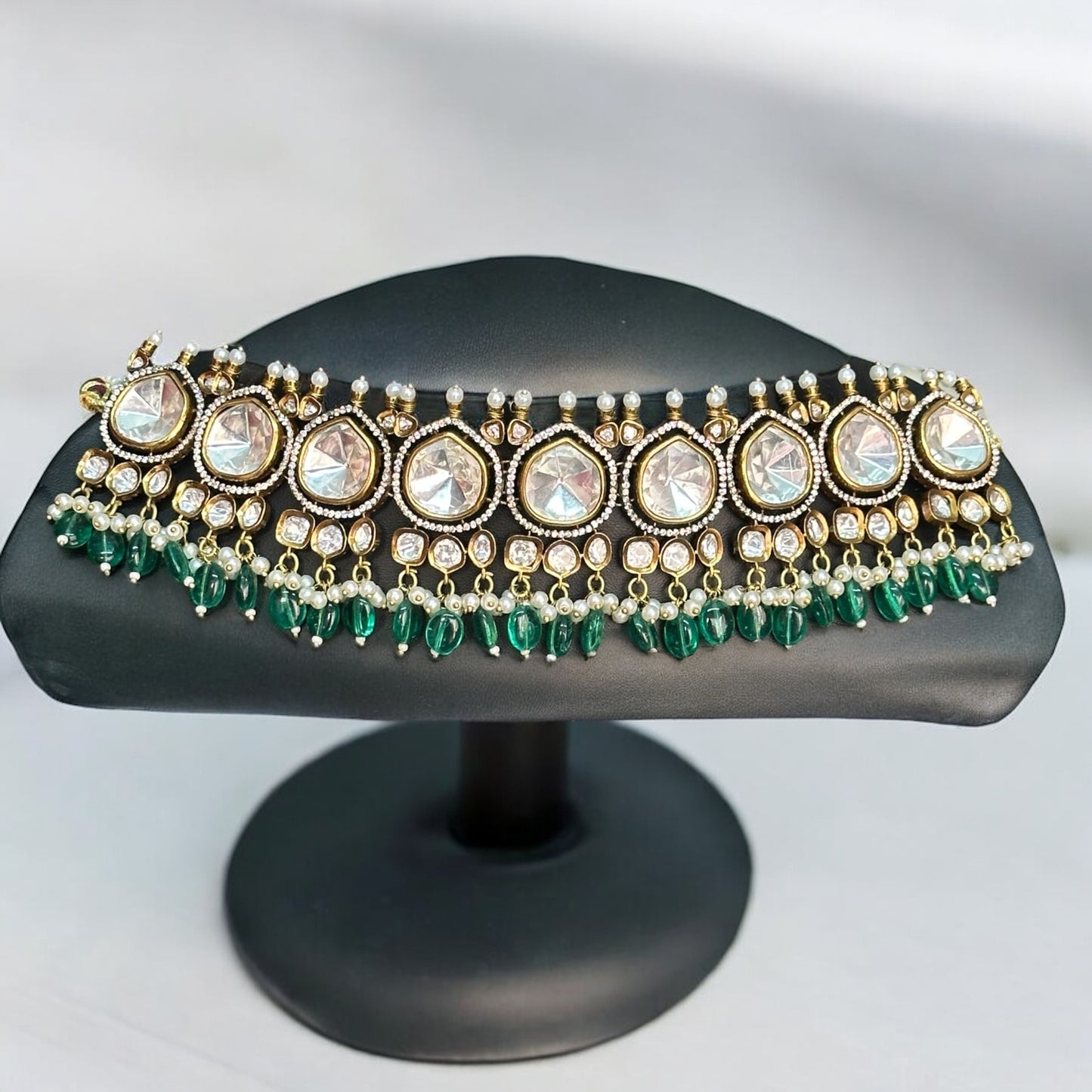Premium Moissanite Polki Kundan Choker in Green – luxurious choker featuring moissanite polki stones, kundan detailing, pearl accents, and green bead drops. Ideal for weddings and festive occasions.