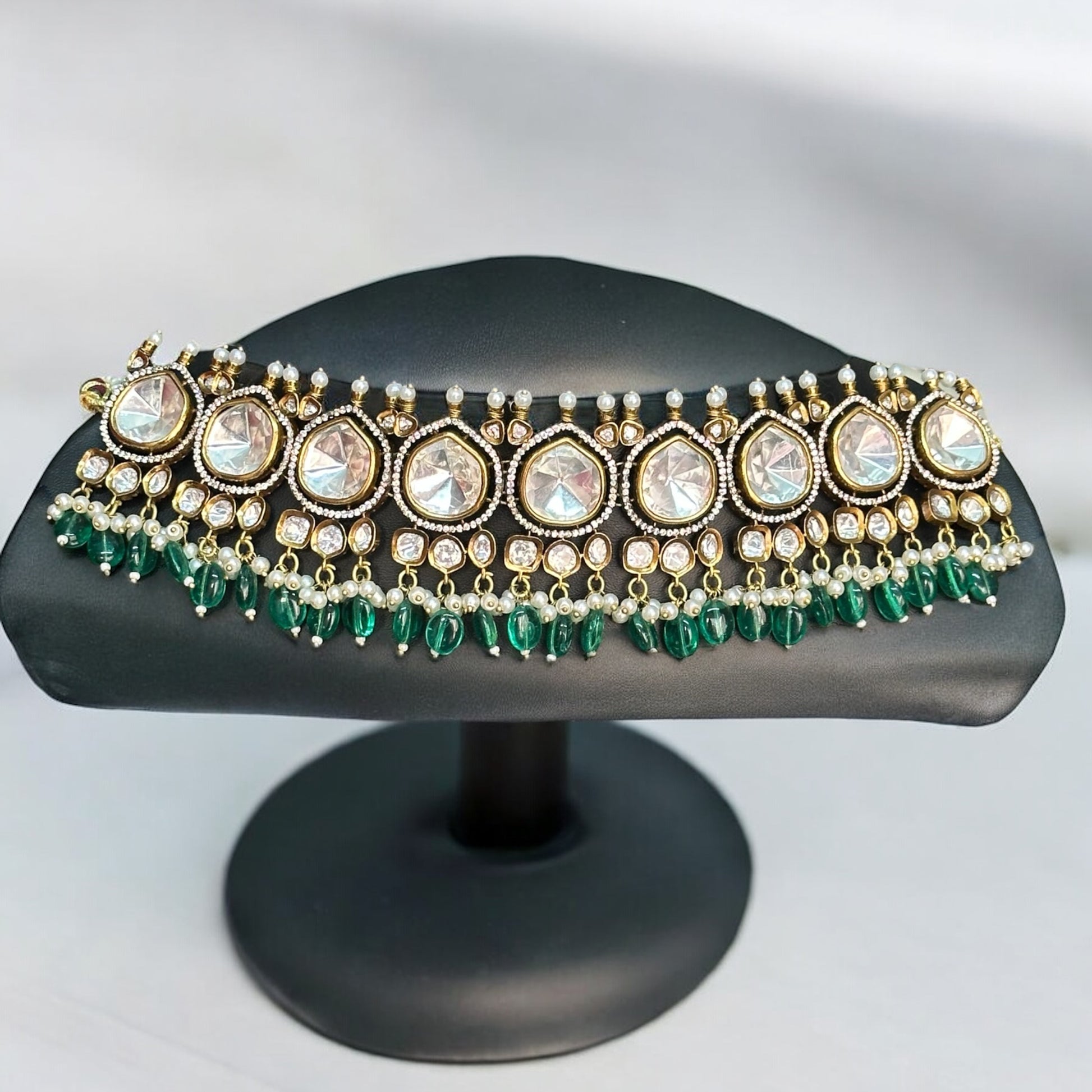 Premium Moissanite Polki Kundan Choker in Green – luxurious choker featuring moissanite polki stones, kundan detailing, pearl accents, and green bead drops. Ideal for weddings and festive occasions.