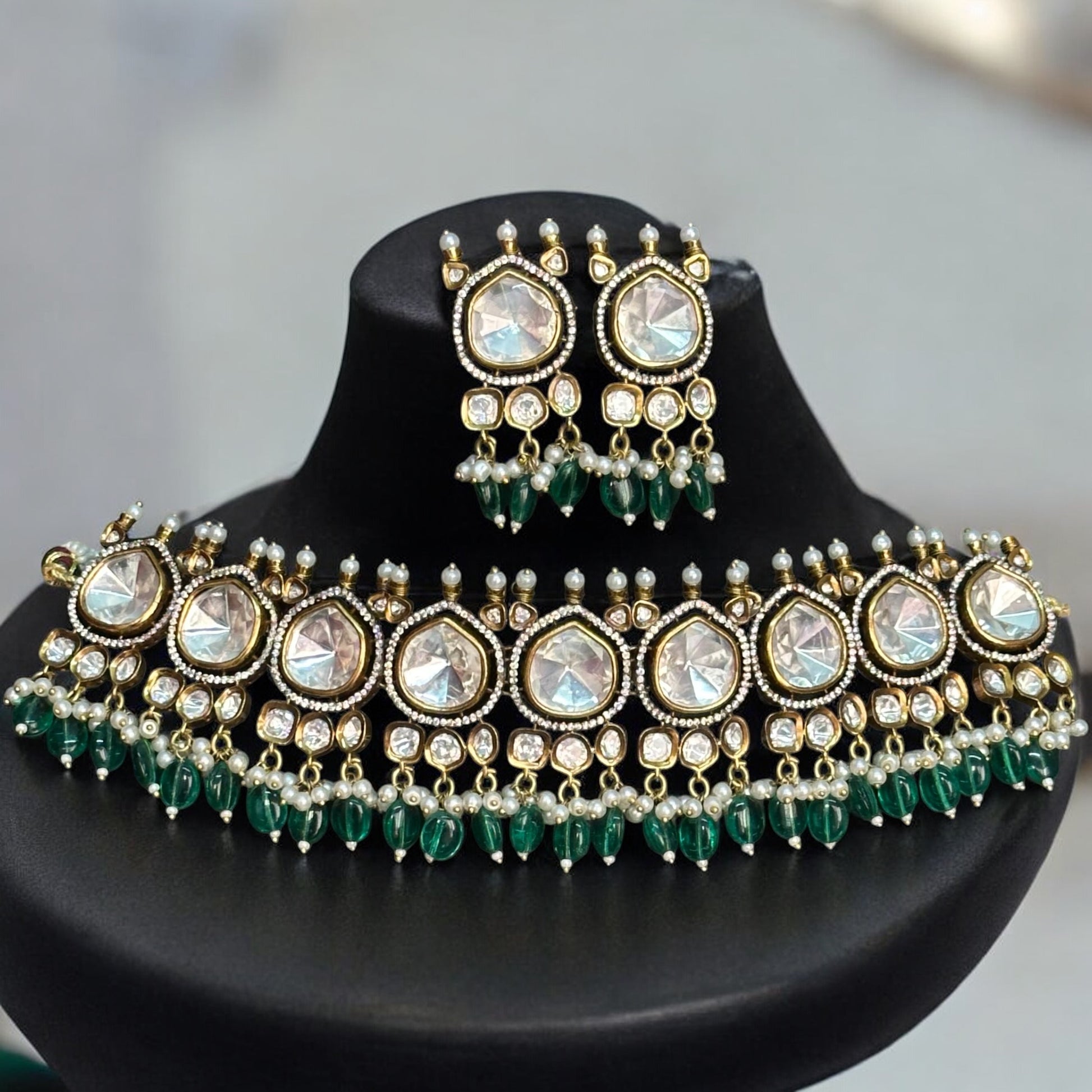 Premium Moissanite Polki Kundan Choker with Earrings in Green – luxurious choker featuring moissanite polki stones, kundan detailing, pearl accents, and green bead drops. Ideal for weddings and festive occasions.